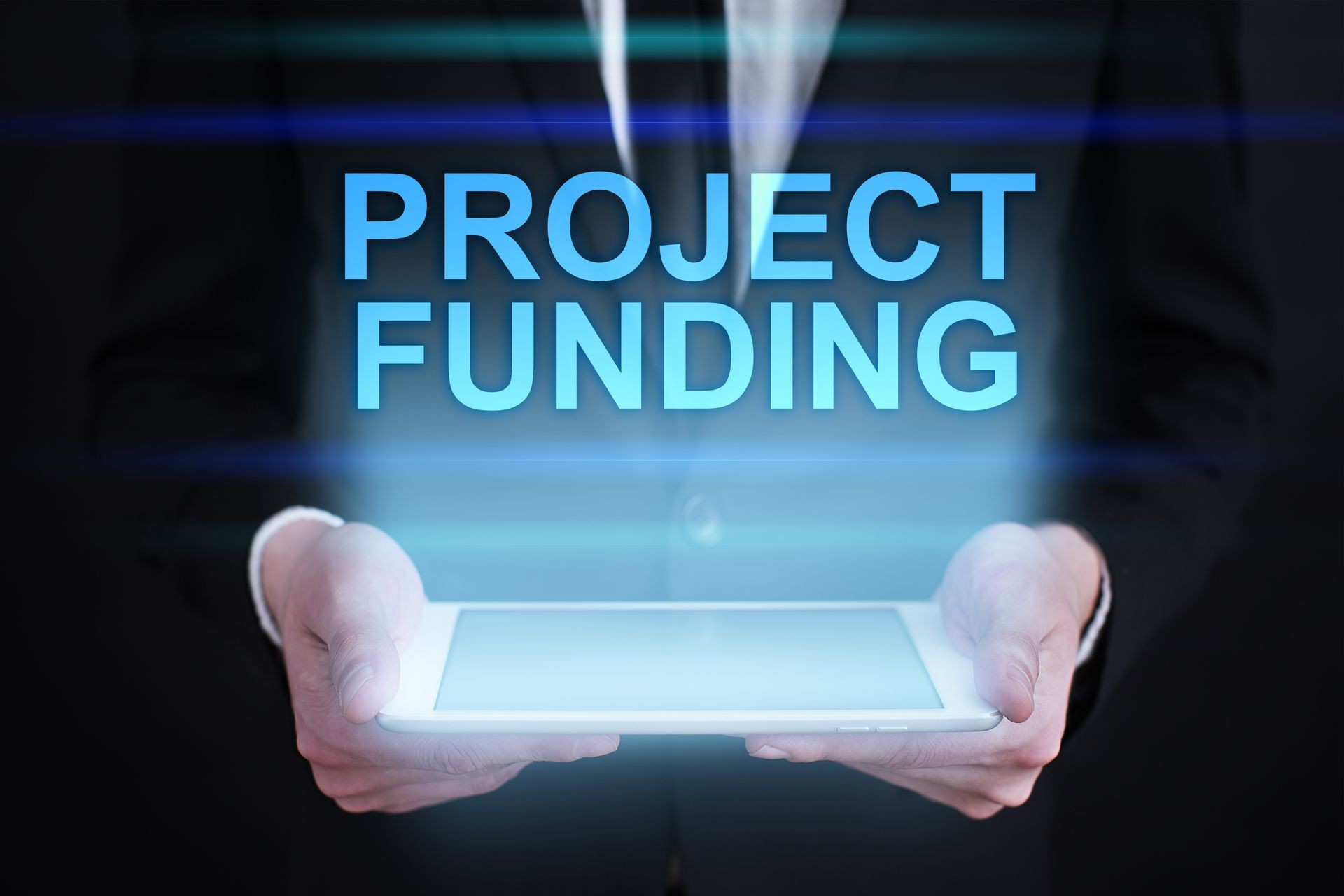 Businessman holding a tablet pc with "Project funding" text on virtual screen. Internet concept. Business concept.